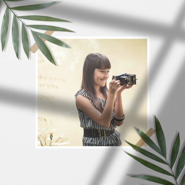 Design Photography of a Girl Holding a Camera, download and edit for free design template - Photography from the Andalusi design app